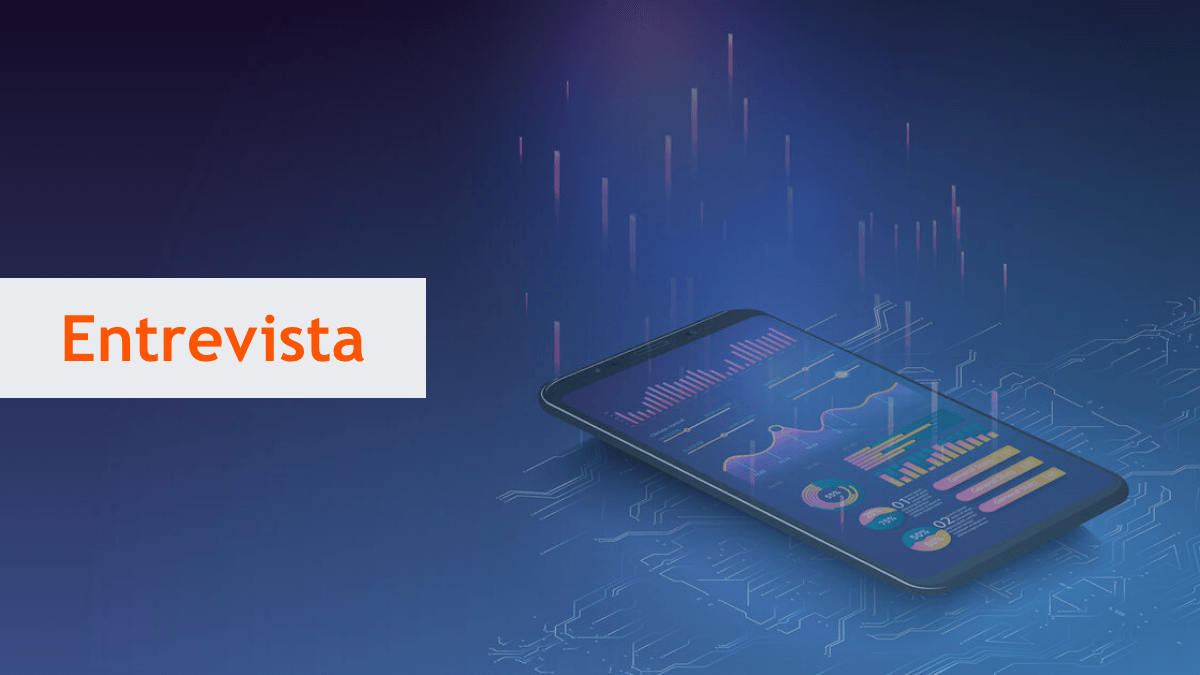 tablet com gráficos digitais; à frente, a palavra Entrevista